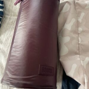 Dagne dover toiletry bag new. Burgundy color